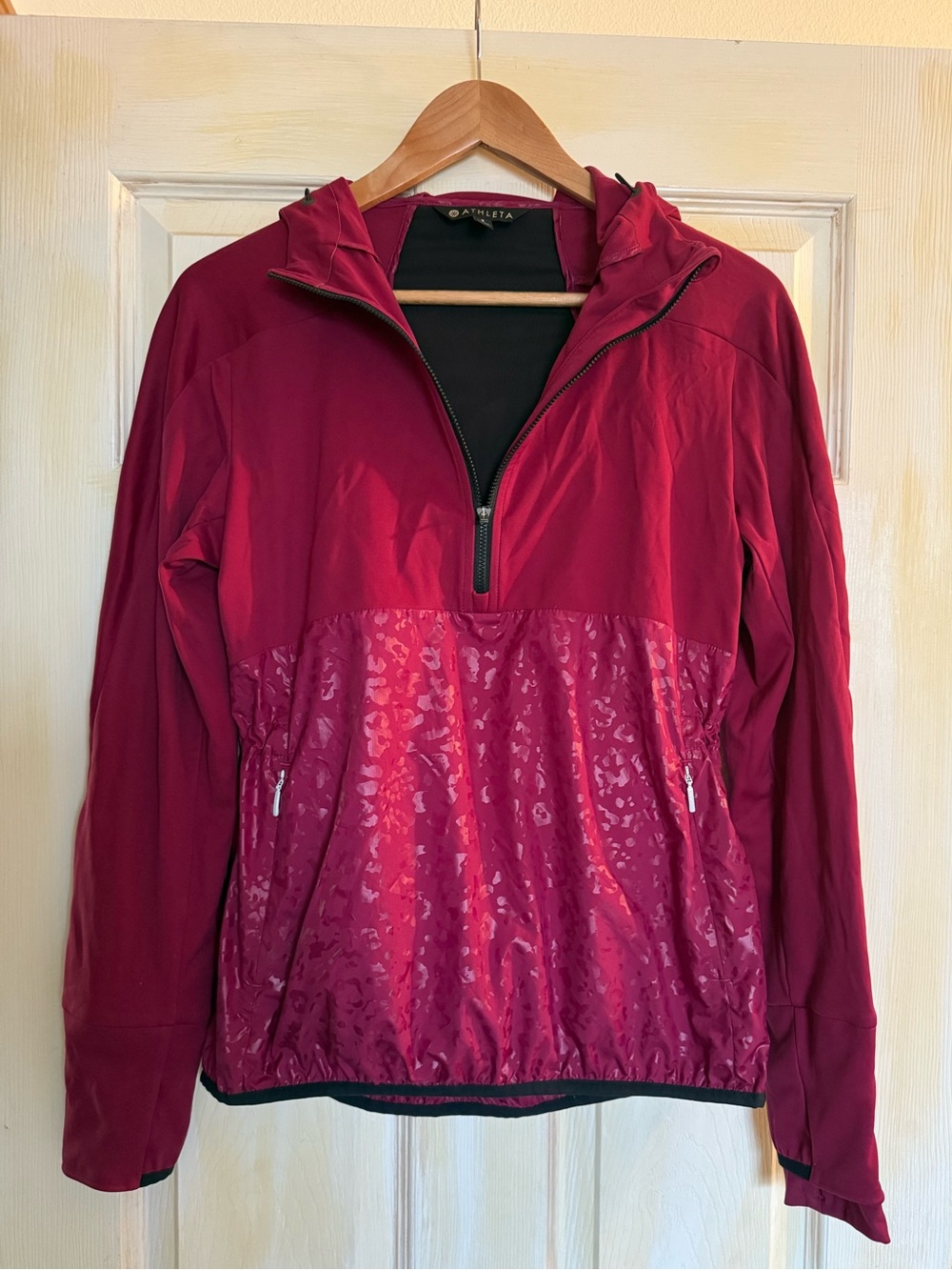 Athleta lightweight half-zip hooded running jacket featuring leopard print